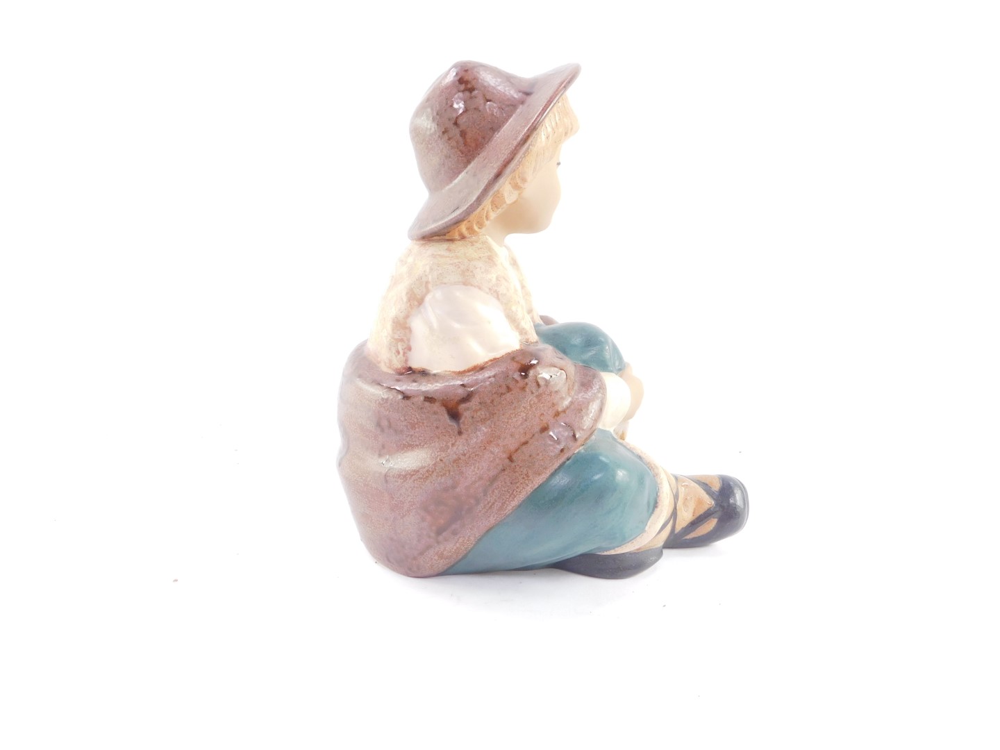 A Nadal matt pottery figure of a boy, modelled seated, printed marks, 22.5cm high. - Bild 2 aus 3