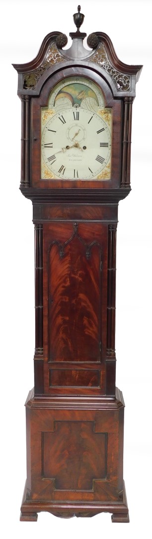 Joseph Wilson of Stamford. An early 19thC flame mahogany longcase clock, the enamel break arch dial