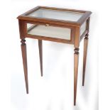 A rectangulart bijouterie table, parquetry decorated with lift top, glazed sides, raised on tapering