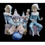 Two Lladro porcelain clown figures modelled as Littlest Clown and Having A Ball, boxed, and two Llad