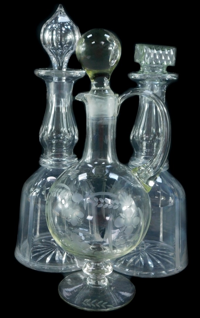 A pair of Victorian cut glass mallet shaped decanters, with one stopper, a further pressed glass mat