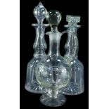 A pair of Victorian cut glass mallet shaped decanters, with one stopper, a further pressed glass mat