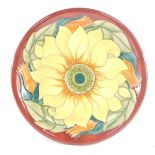 A Moorcroft pottery plate decorated in the Inca Sunflower pattern, painted and impressed marks, 26cm