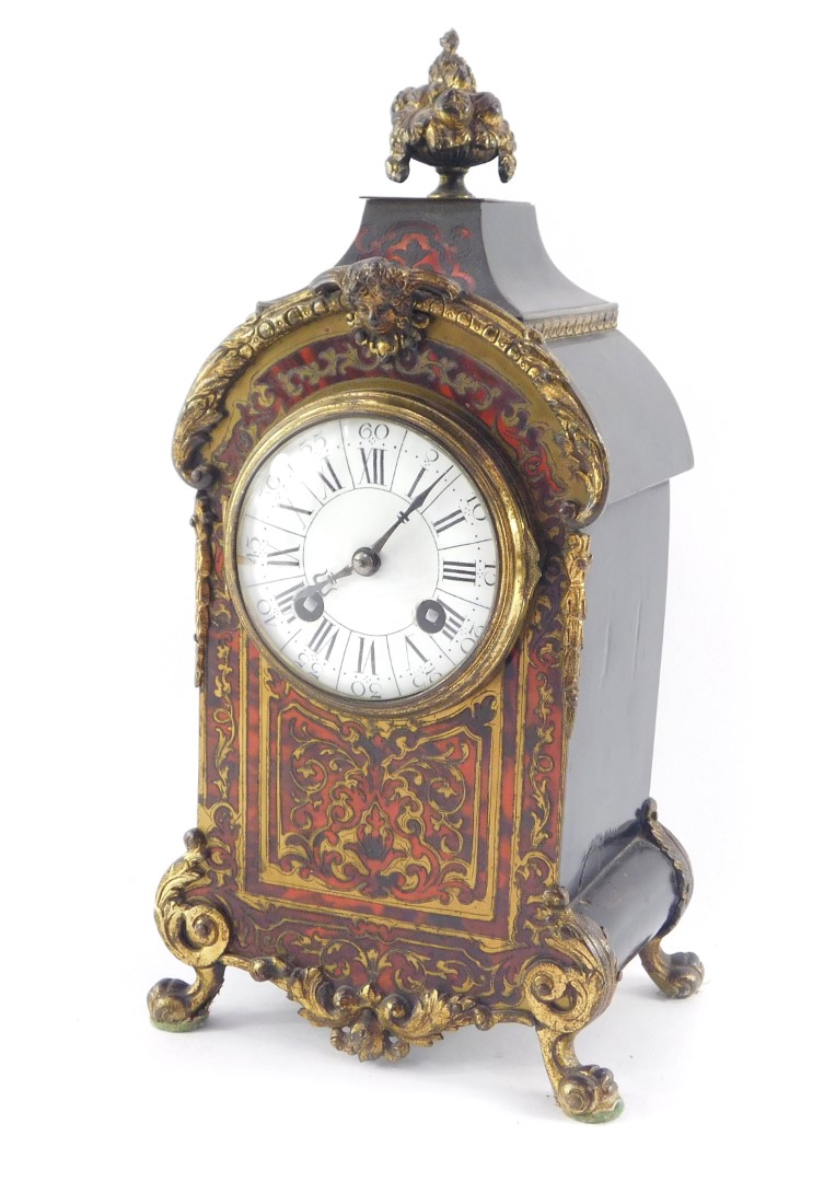 A French late 19thC Boulle mantel clock, circular enamel dial bearing Roman and Arabic numerals, eig