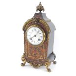 A French late 19thC Boulle mantel clock, circular enamel dial bearing Roman and Arabic numerals, eig