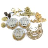 Military cap badges and buttons, including the Northamptonshire Regiment, and Royal Artillery. (a qu