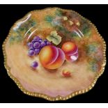 A Royal Worcester porcelain cabinet plate, signed Leaman, painted with peaches and black grapes, 22
