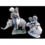 A Lladro porcelain figure modelled as Eskimo Riders, and a further figure group modelled as Hindu ch