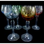 A set of six mid century harlequin coloured wine glasses, engraved with flowers.