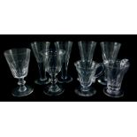 Four Victorian cut glass wine glasses, with fluted bowls and stems, two further wine glasses and two