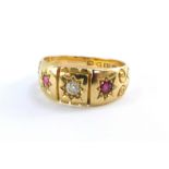 An Edwardian lady's 18ct gold diamond and ruby three stone ring, size M, 4.2g.