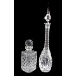 A cut glass decanter and stopper, engraved with flowers, 50.5cm high, and a cut glass whisky decante