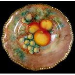 A Royal Worcester porcelain cabinet plate, signed J Cook, painted with apples and green grapes, 25cm