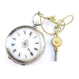 A lady's silver pocket watch, open faced, key wind, enamel dial bearing Roman numerals, the case wit