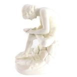 A late 19thC parian porcelain figure of The Spinario, After The Antique, raised on a naturalistic ov