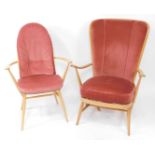 An Ercol blonde elm and ash wingback Windsor armchair, with loose cushion seat, together with a blon