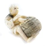 A Japanese Taisho period Japanese ivory netsuke of a man with a basket and bowl, unsigned, 42mm high