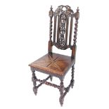 A Victorian oak hall chair, the crest rail and splat carved with vines, solid seat with floral decor