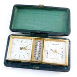 A Looping vintage travel clock with barometer and thermometer, eight day movement, number 80540, in