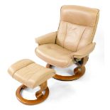 An Ekornes Stressless tan leather swivel armchair, together with a matching foot stool. (2)