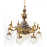A French Empire style early 20thC bronzed and gilt metal chandelier, the cast and stepped centre sec