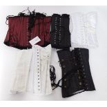 Five heavy steel boned training corsets, size 30, to fit 32-36 inch waist, comprising black jacquard