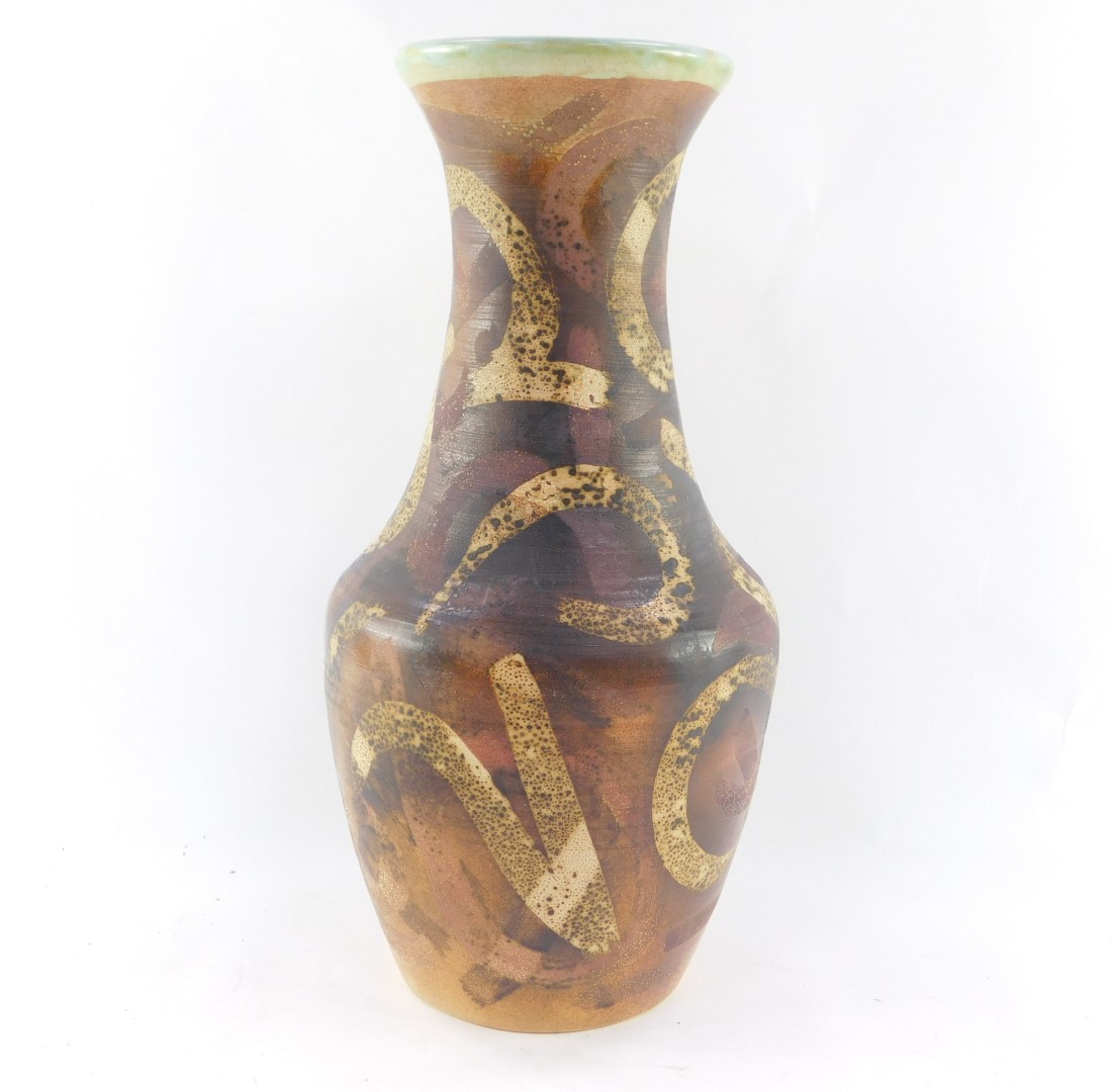 A Raymond Everett of Rye pottery vase, c1960's, decorated with stylised figural motifs against a bro