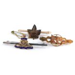 A 9ct gold maple leaf bar brooch, engraved for Canada, a Victorian 9ct gold brooch cast with a bird