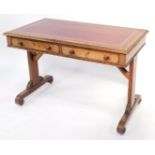 A William IV mahogany library table, with a later red seam inset top, over a pair of frieze drawers,