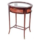 A French 19thC style mahogany bijouterie table, of oval form, with glazed hinged lid and sides, rais