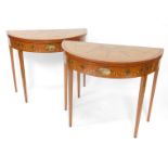 A pair of 19thC Sheraton revival hand painted satinwood demi lune card tables, with baize lined fold