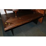 A dark wood coffee table with a steel twin pedestal base, 40cm high, 120cm wide, 70cm deep.