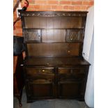 A dark oak veneered kitchen dresser, with open delft rack, above sideboard base, 180cm high, 125cm