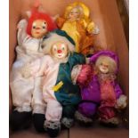 Four vintage models of clowns, various sizes, variously attired.