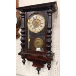 An early 20thC Vienna style wall clock, 16cm diameter Roman numeric dial, flanked by two ¼