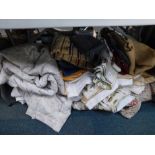 Assorted linen, curtains, material, soft furnishing, etc. (a large quantity)