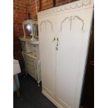 A cream painted French style bedroom suite, comprising wardrobe, 178cm high, 92cm wide, 54cm