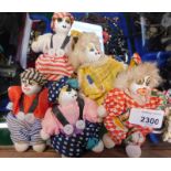 Five vintage models of clowns, with porcelain faces, variously attired, 10cm high.