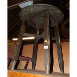 A mid 20thC wooden pub table, with red Formica top, 66cm high, 55cm diameter.