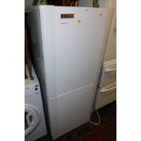 A Hoover Aristocrat fridge freezer, model HCF1435WA, 141cm high.