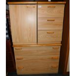 An elm effect chest of three drawers, 66cm high, 81cm wide, 54cm deep., together with two bedside