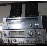 A Rotel integrated stereo amplifier, RA-913, and a Rotel AM/FM stereo tuner, RT-426, a pair