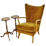 A mid-century crook arm fireside armchair and a pair of mahogany wine tables. (AF)