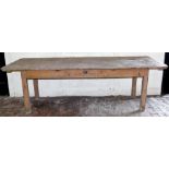 An early Victorian painted pine refectory or dairy table, with plank top, single frieze drawer and s