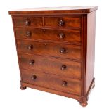 A Victorian flame mahogany chest, of two short and four graduated drawers, with knob handles having
