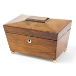 A Victorian mahogany sarcophagus tea caddy, the domed top with reeded bordering and a ivory key hole