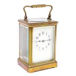 A gilt brass carriage clock, with time piece movement, with enamel dial, 13.5cm high excluding handl