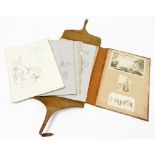 A 19thC artist's portfolio, with marbled boards and leather bindings with strap containing a small c