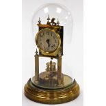 A brass anniversary clock, with two wind movement in a plastic dome, 31cm high.