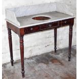 An early Victorian mahogany washstand, with marble tray top having recess, two frieze drawers and tu